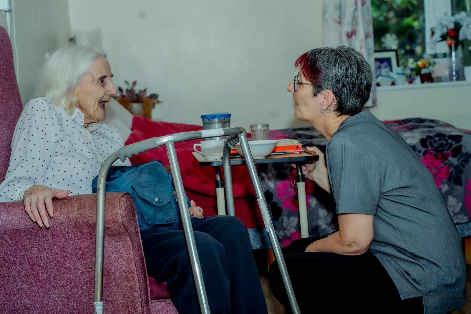 A Dove Court care team member spending time with a resident
