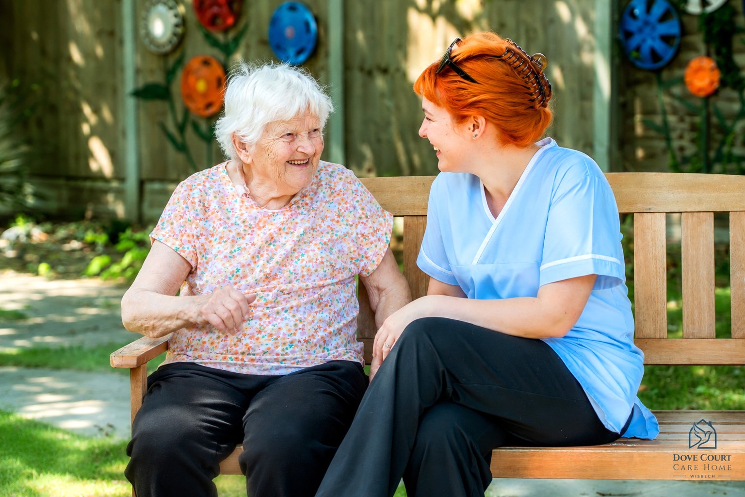 A Dove Court carer spending meaningful time with a resident